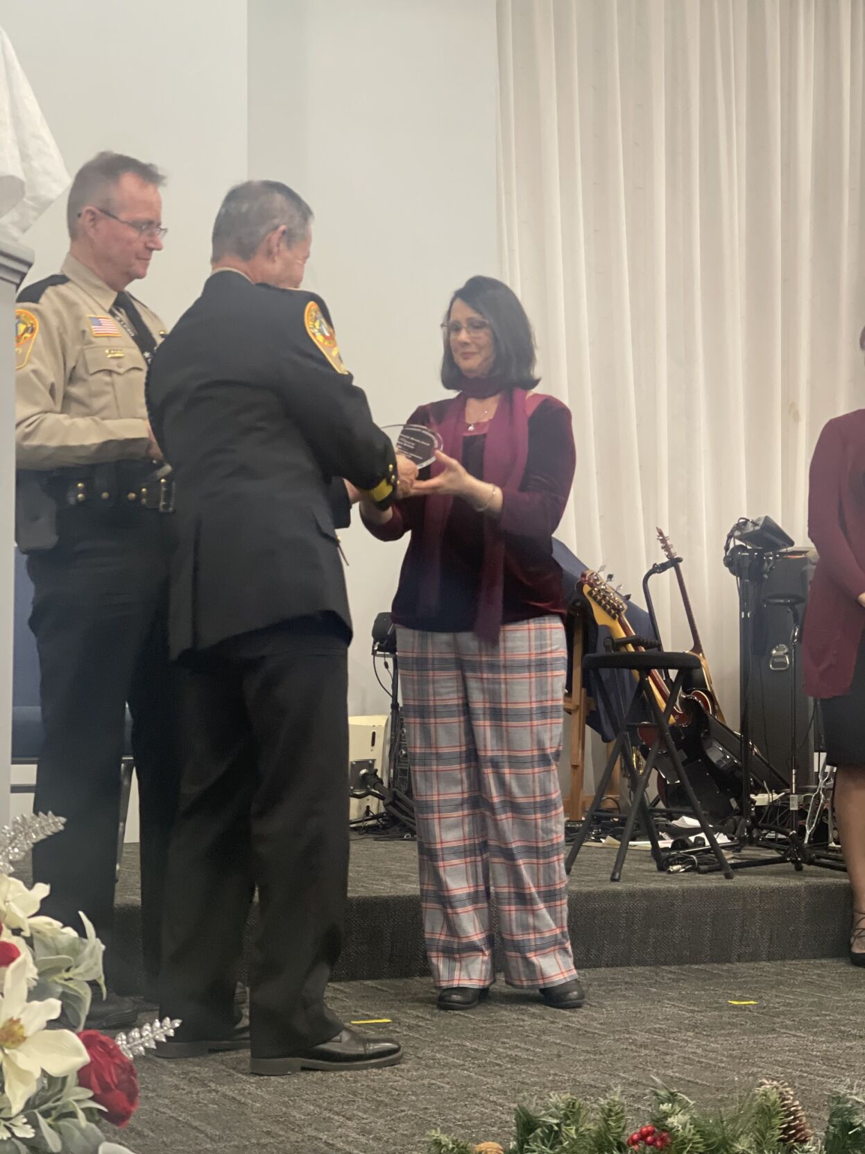Louisa Sheriff Donald Lowe and PIO Chuck Love present Kathy Kuhnle and the family of Bob Kuhnle with Bob’s LCSO Community Service Award